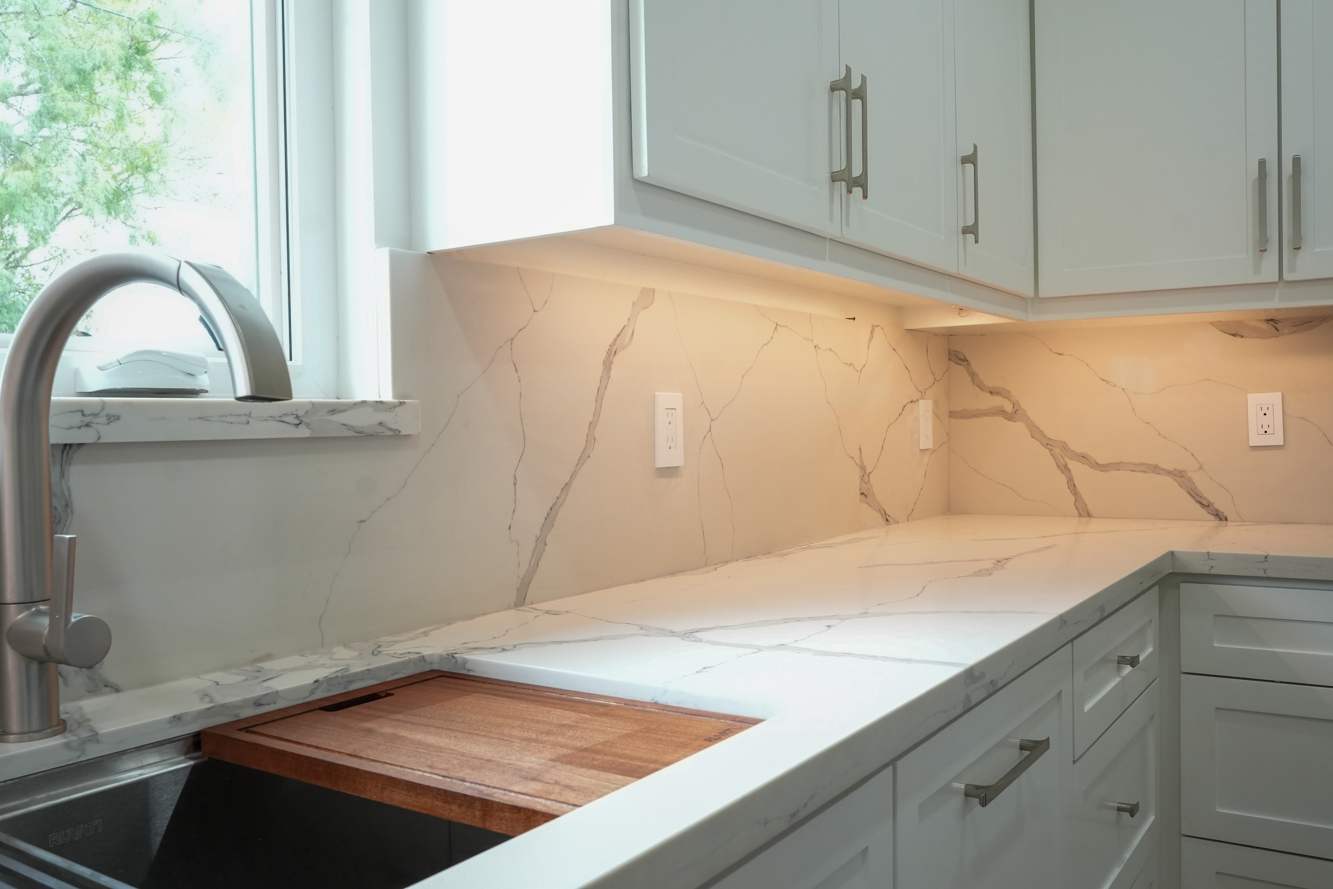 The Romero Residence — kitchen with floor-to-ceiling cabinets